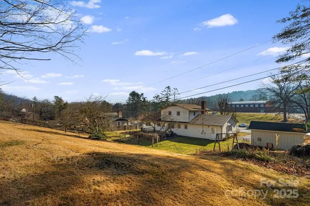 a view of a swimming pool with an outdoor seating and a garden