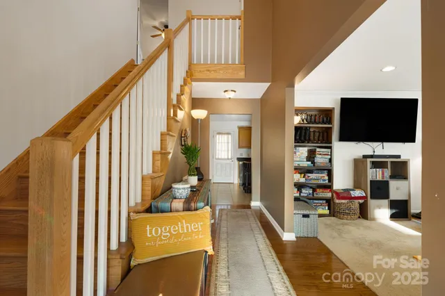a view of a living room with furniture and a flat screen tv