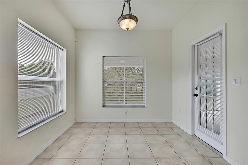 12052 Jade Avenue Spring Hill, FL 34609 - Photo 13 of 45 a view of an empty room with a window