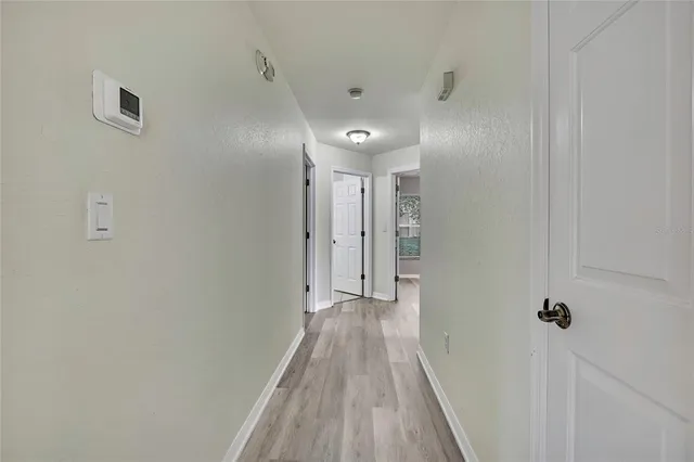 a view of a bathroom from the hallway