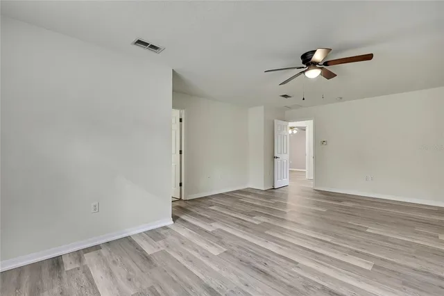 a bathroom with a granite countertop sink mirror and a bathtub