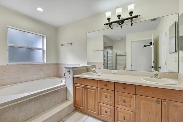 a bathroom with a bathtub and shower