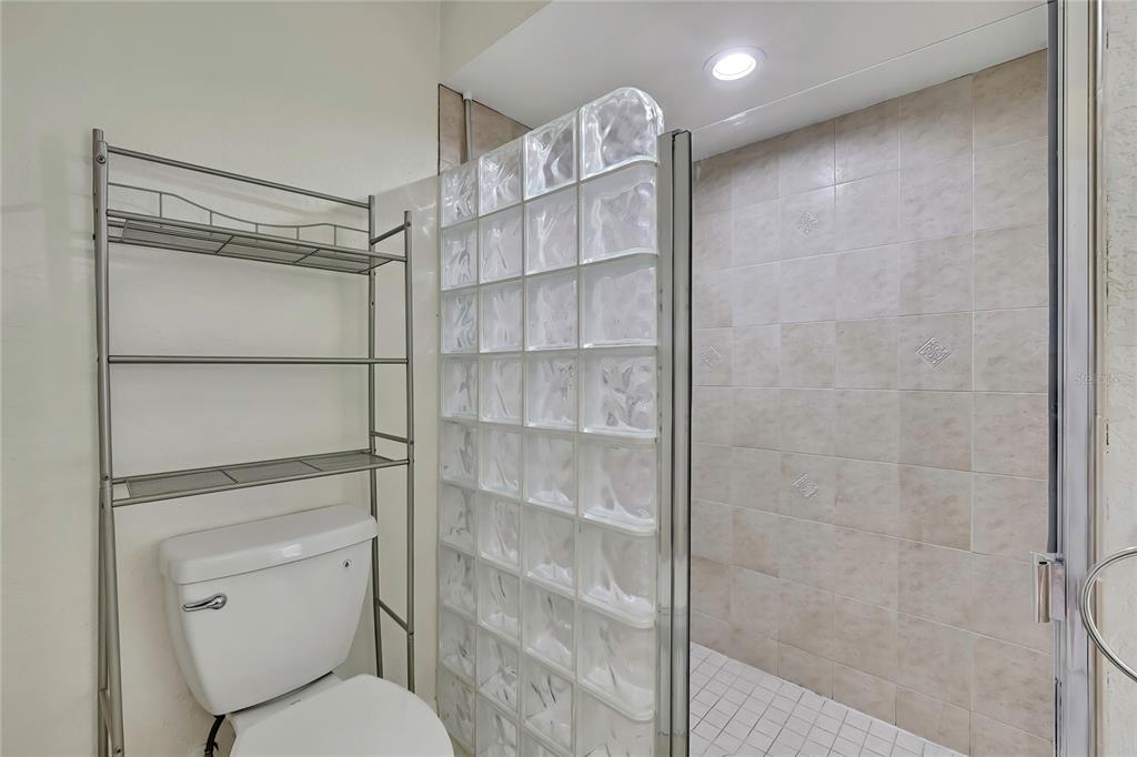 12052 Jade Avenue Spring Hill, FL 34609 - Photo 19 of 45 a bathroom with a toilet and a shower