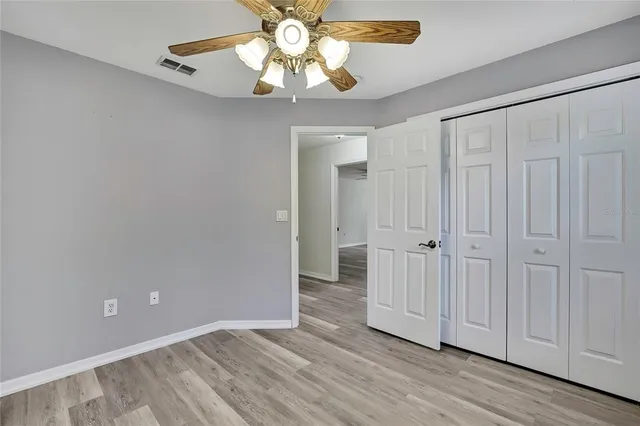 a bathroom with a sink toilet vanity and shower