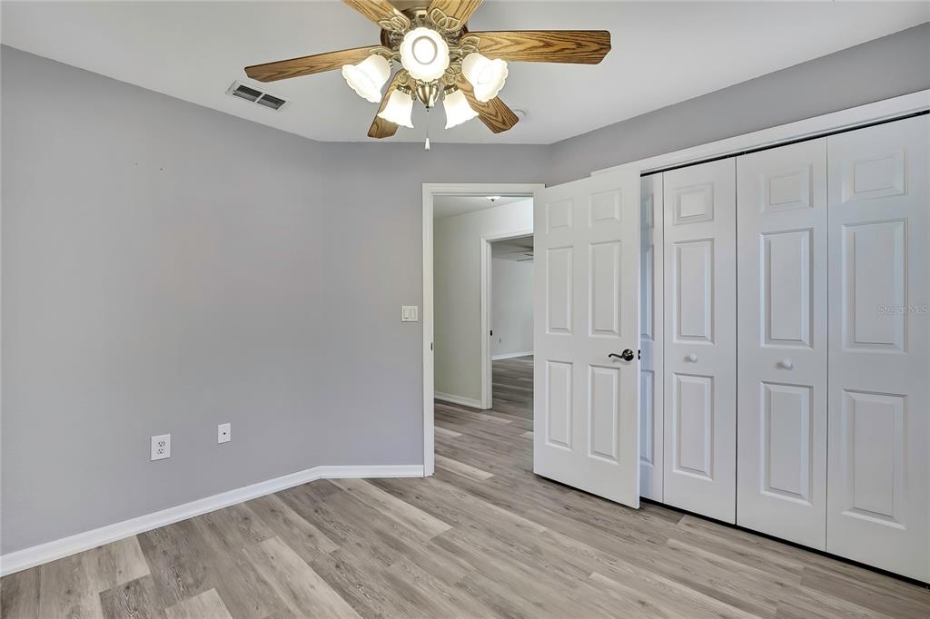 12052 Jade Avenue Spring Hill, FL 34609 - Photo 30 of 45 wooden floor in an empty room with a window