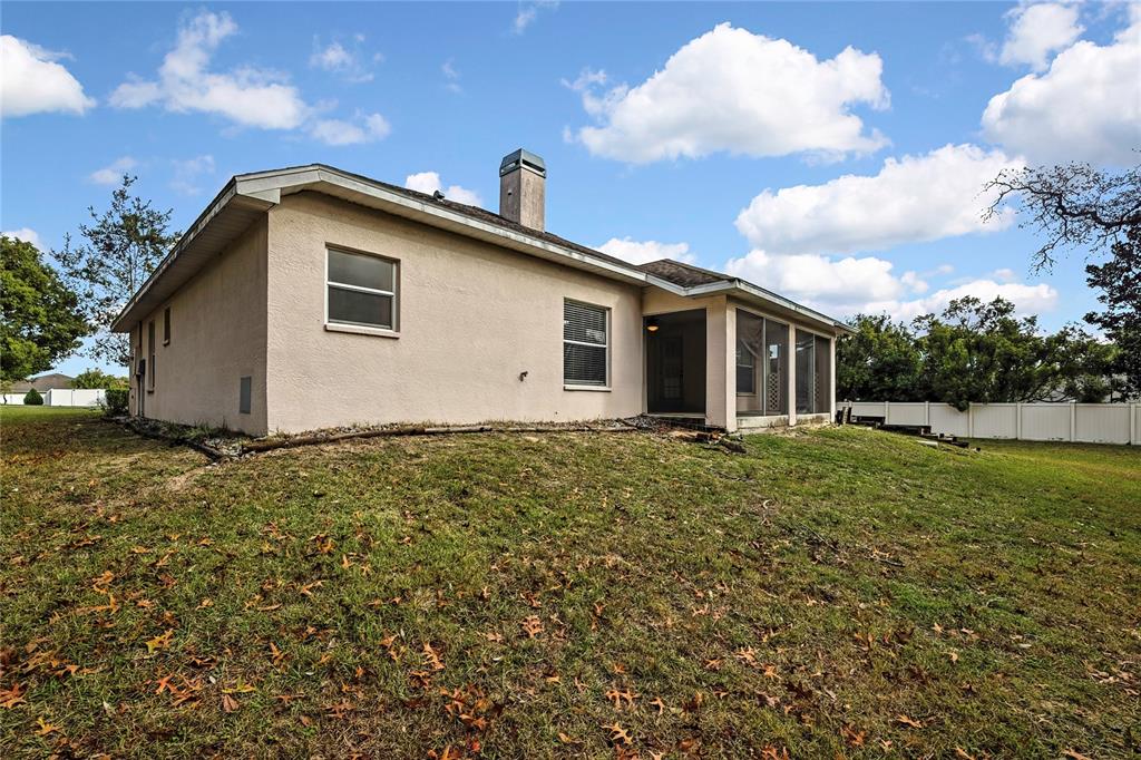12052 Jade Avenue Spring Hill, FL 34609 - Photo 33 of 45 a view of a house with backyard