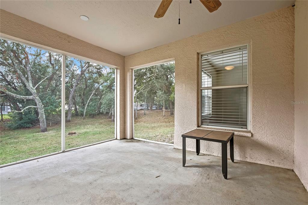 12052 Jade Avenue Spring Hill, FL 34609 - Photo 40 of 45 a view of an empty room with a window and balcony