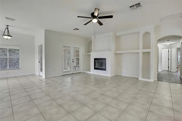 a view of an empty room with a fireplace