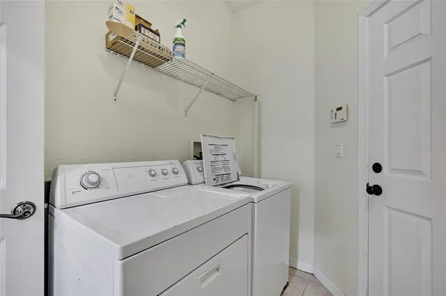 a view of a bathroom with utility and sink