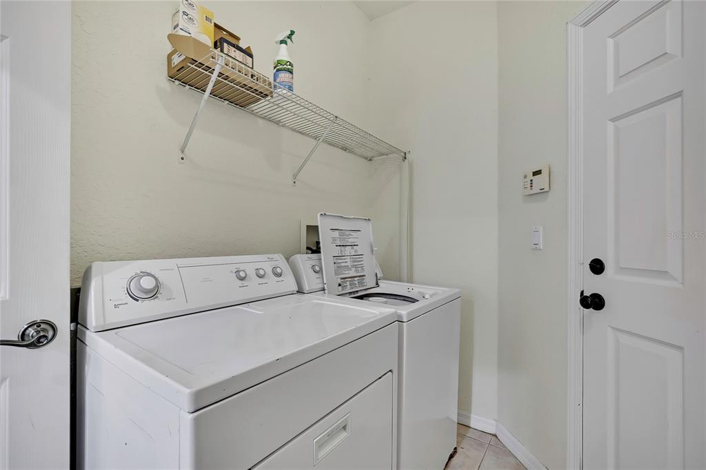 12052 Jade Avenue Spring Hill, FL 34609 - Photo 42 of 45 a utility room with dryer and washer