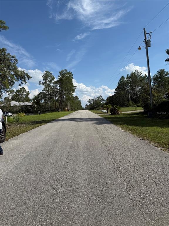 Aspen Street Eustis, FL 32736 - Photo 17 of 19 a view of a street with a building in the background