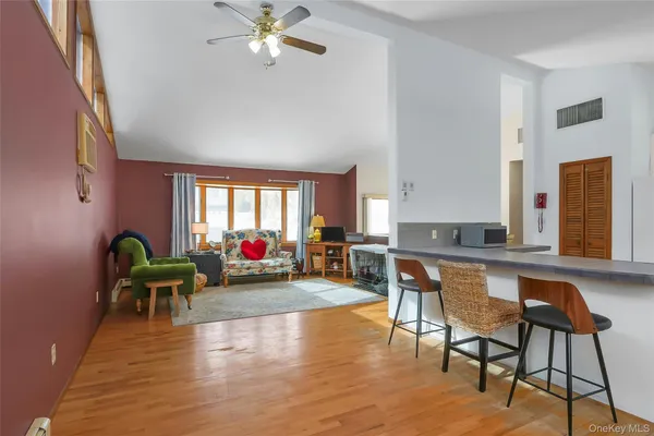 a room with chairs and window