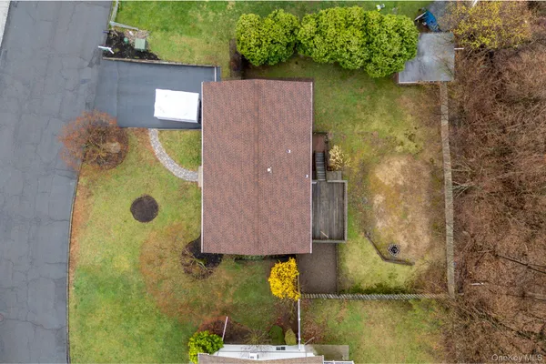 a view of a house with a yard and garage