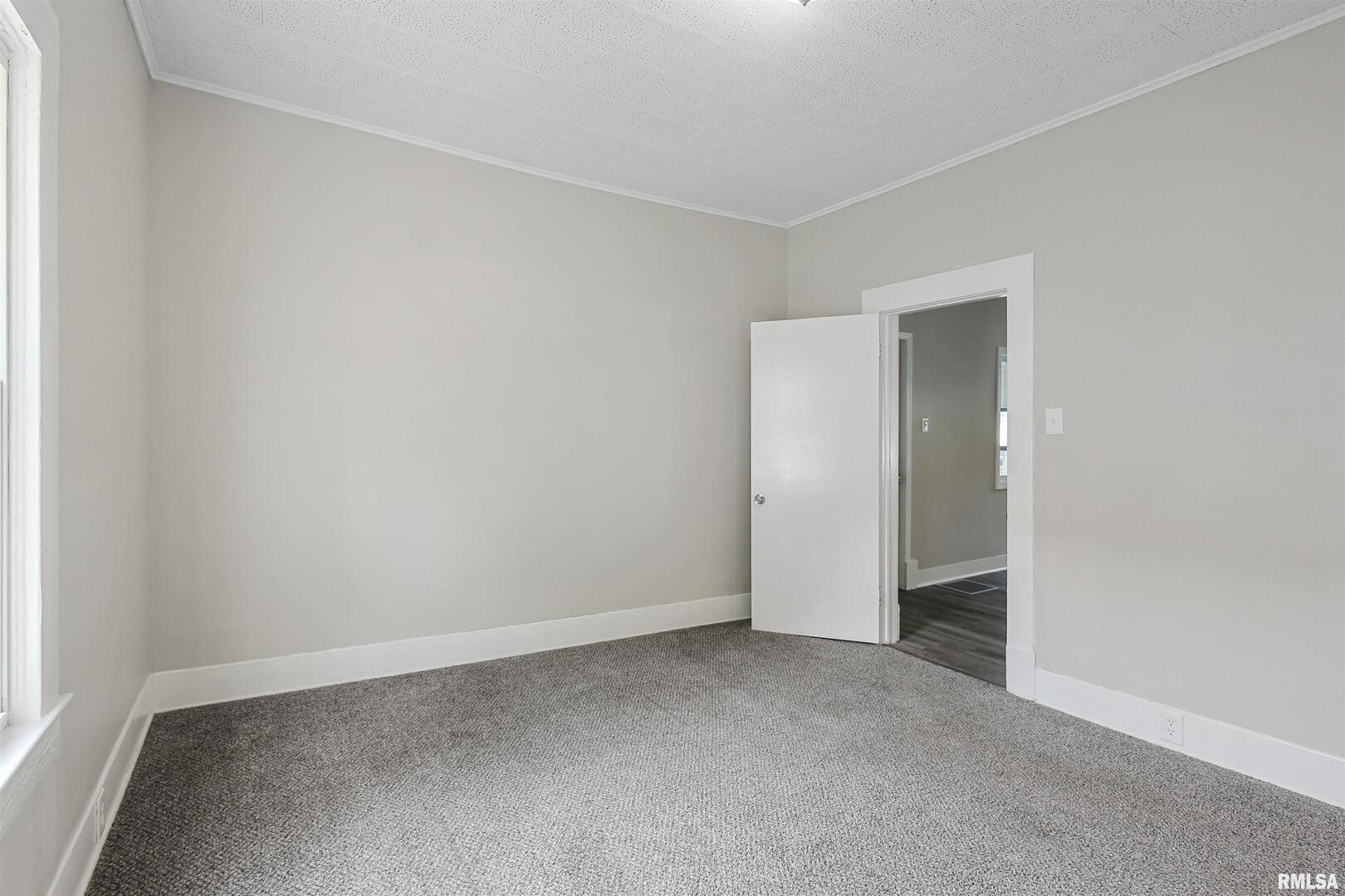 208 South 10th Street Herrin, IL 62948 - Photo 12 of 24 a view of an empty room
