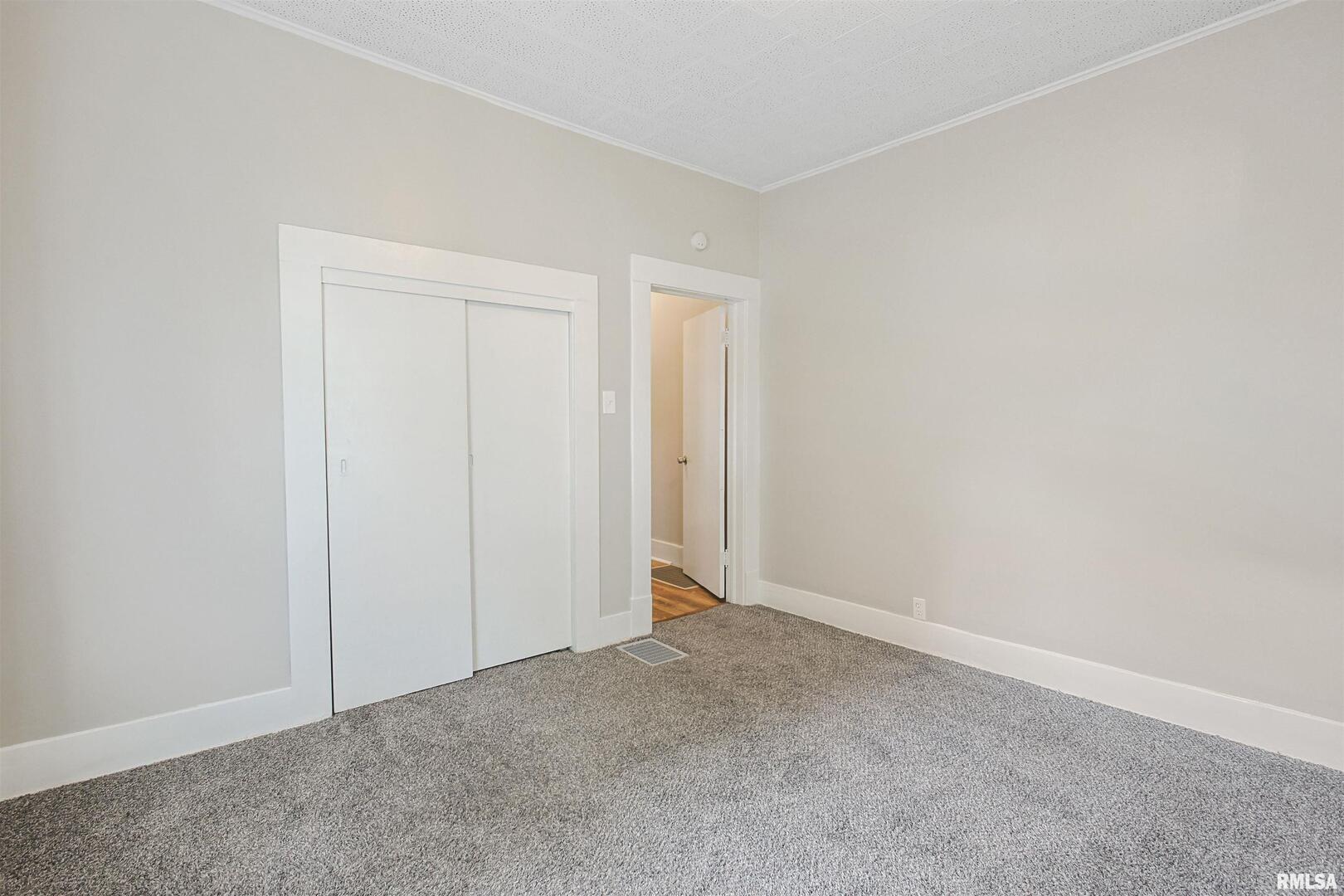 208 South 10th Street Herrin, IL 62948 - Photo 13 of 24 a view of an empty room and closet area