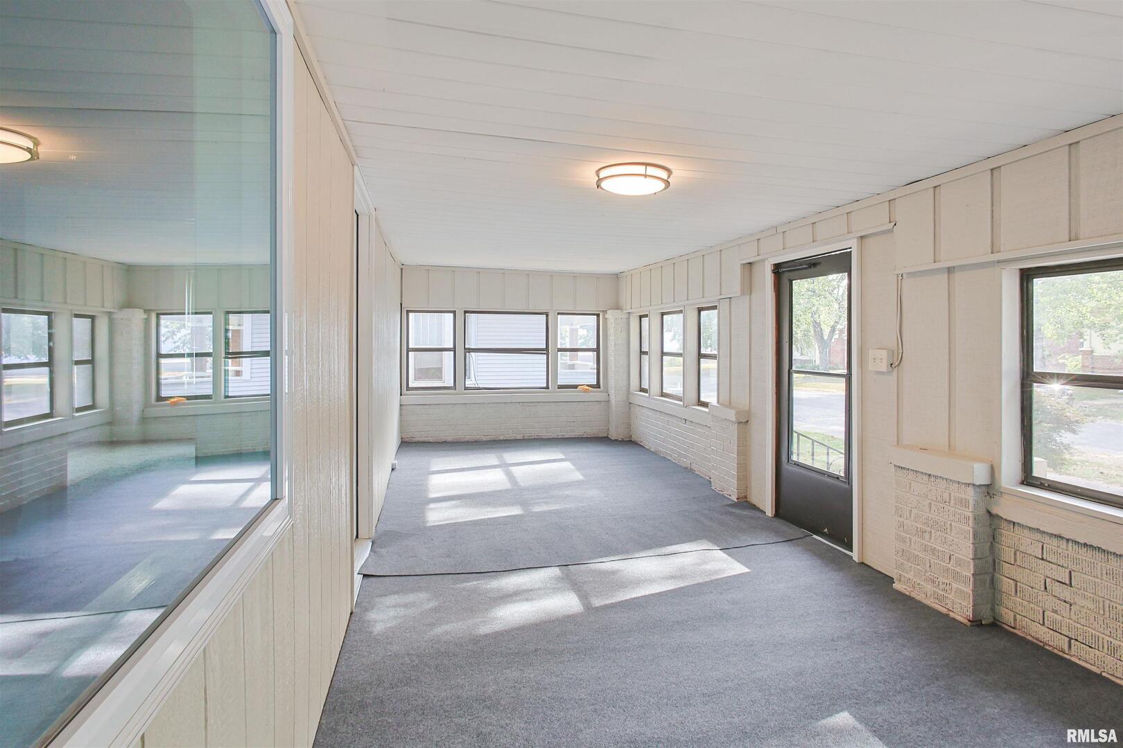 208 South 10th Street Herrin, IL 62948 - Photo 18 of 24 a view of entryway with window and chandelier