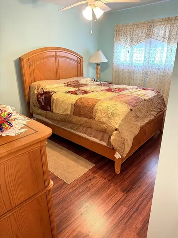 a bedroom with a bed and a lamp