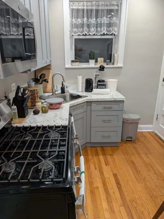 a kitchen with a stove and a sink