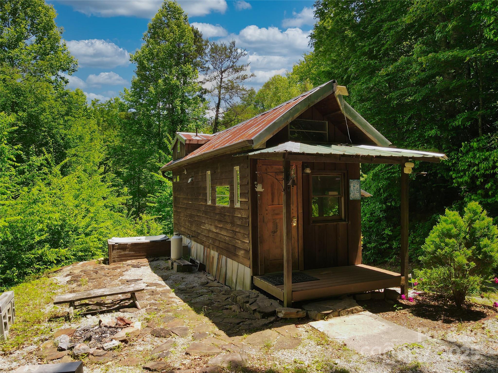 3929 Parker Padgett Road Old Fort, NC 28762 - Photo 2 of 23 a front view of a house with garden
