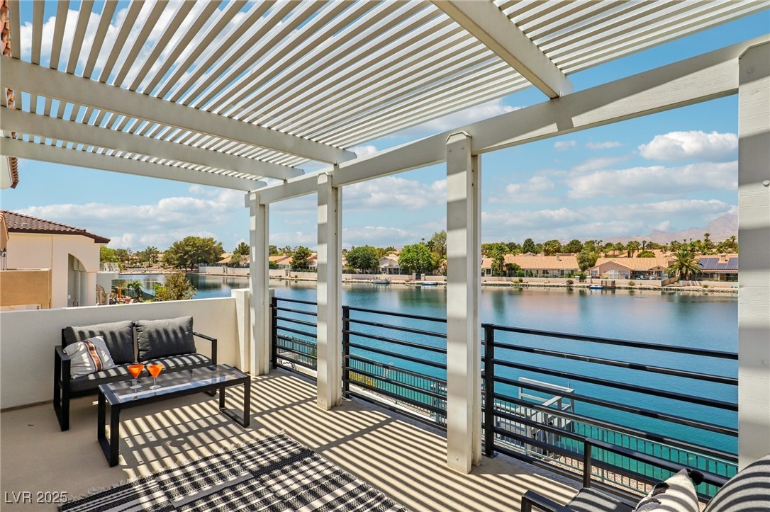 2469 Sun Reef Road Las Vegas, NV 89128 - Photo 70 of 93 Balcony featuring a pergola, a water view, and outdoor lounge area