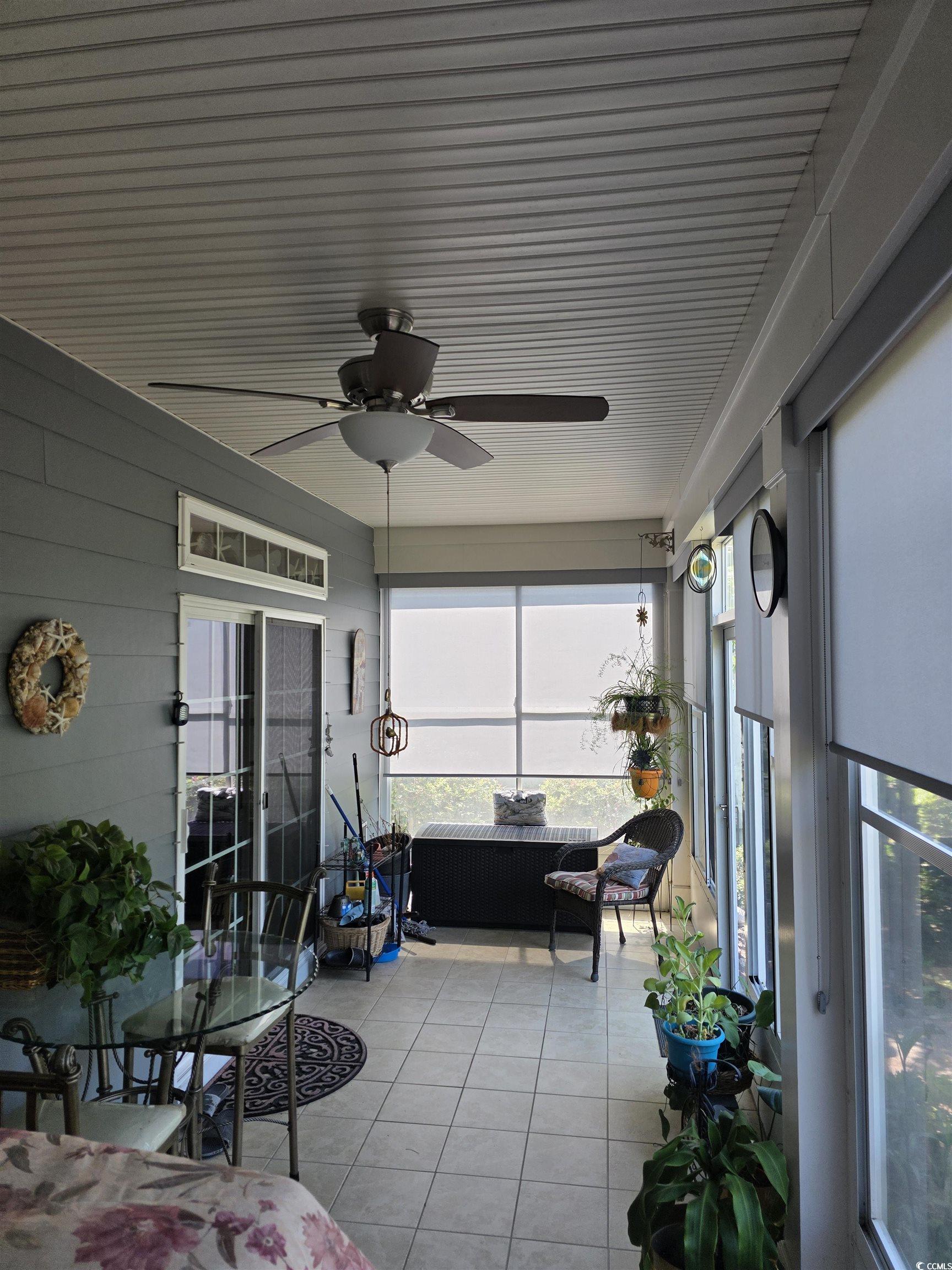1575 Berkshire Avenue Myrtle Beach, SC 29577 - Photo 24 of 30 Sunroom / solarium with tile patterned floors, healthy amount of natural light, and ceiling fan