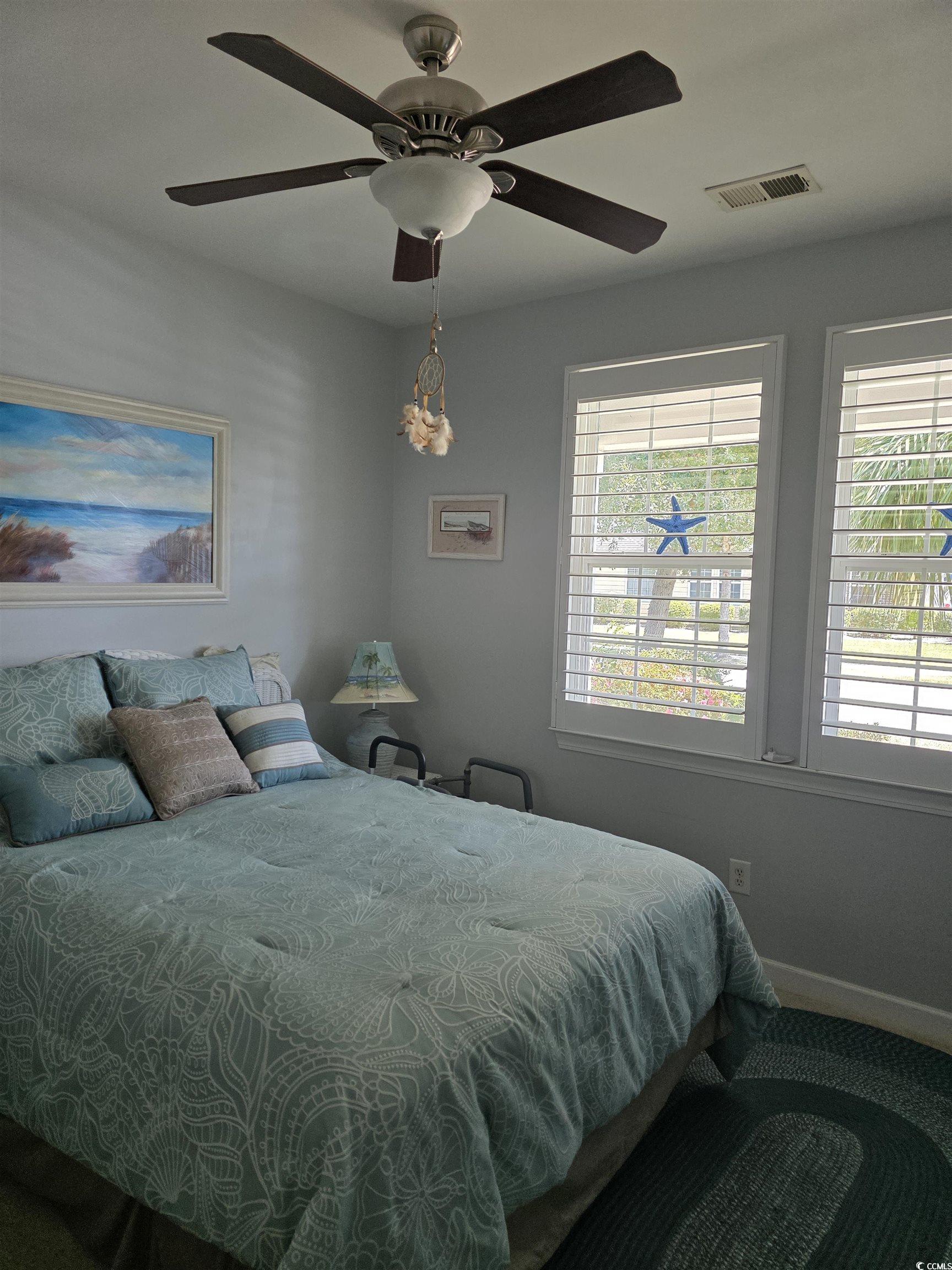 1575 Berkshire Avenue Myrtle Beach, SC 29577 - Photo 4 of 30 Bedroom featuring a ceiling fan and baseboards
