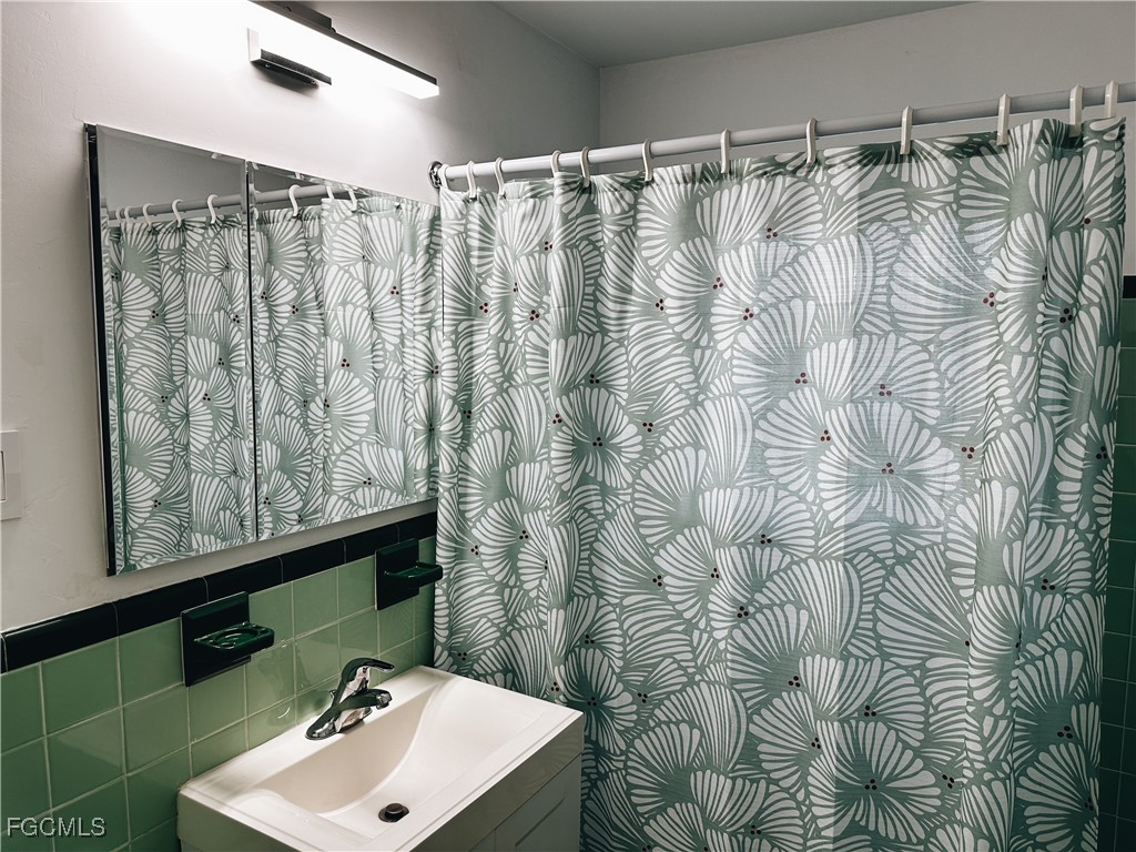 4360 Deleon Street Fort Myers, FL 33901 - Photo 15 of 23 a bathroom with a sink and a mirror