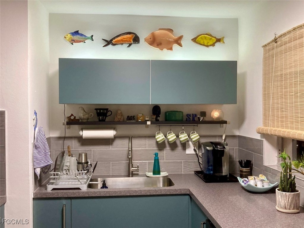 4360 Deleon Street Fort Myers, FL 33901 - Photo 6 of 23 a kitchen with a sink and a stove