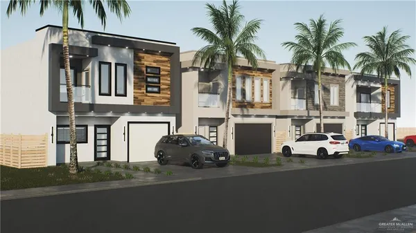 a front view of multiple houses with yard