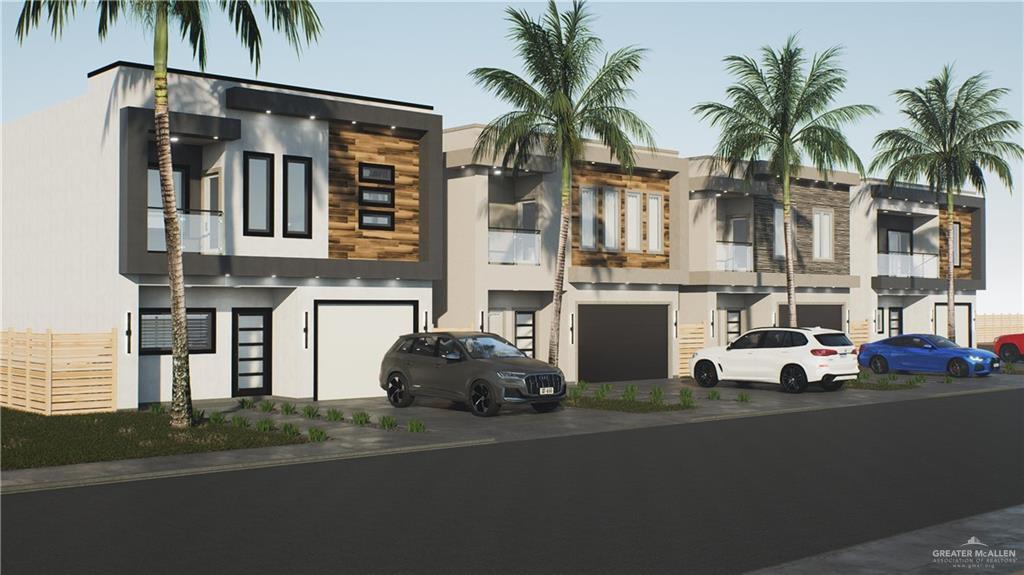 a front view of multiple houses with yard