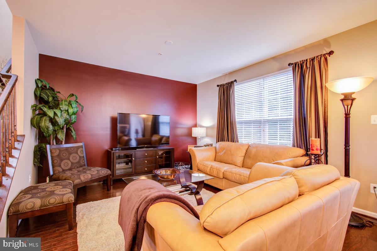 12601 Rustic Rock Lane Beltsville, MD 20705 - Photo 13 of 33 a living room with furniture and a large window