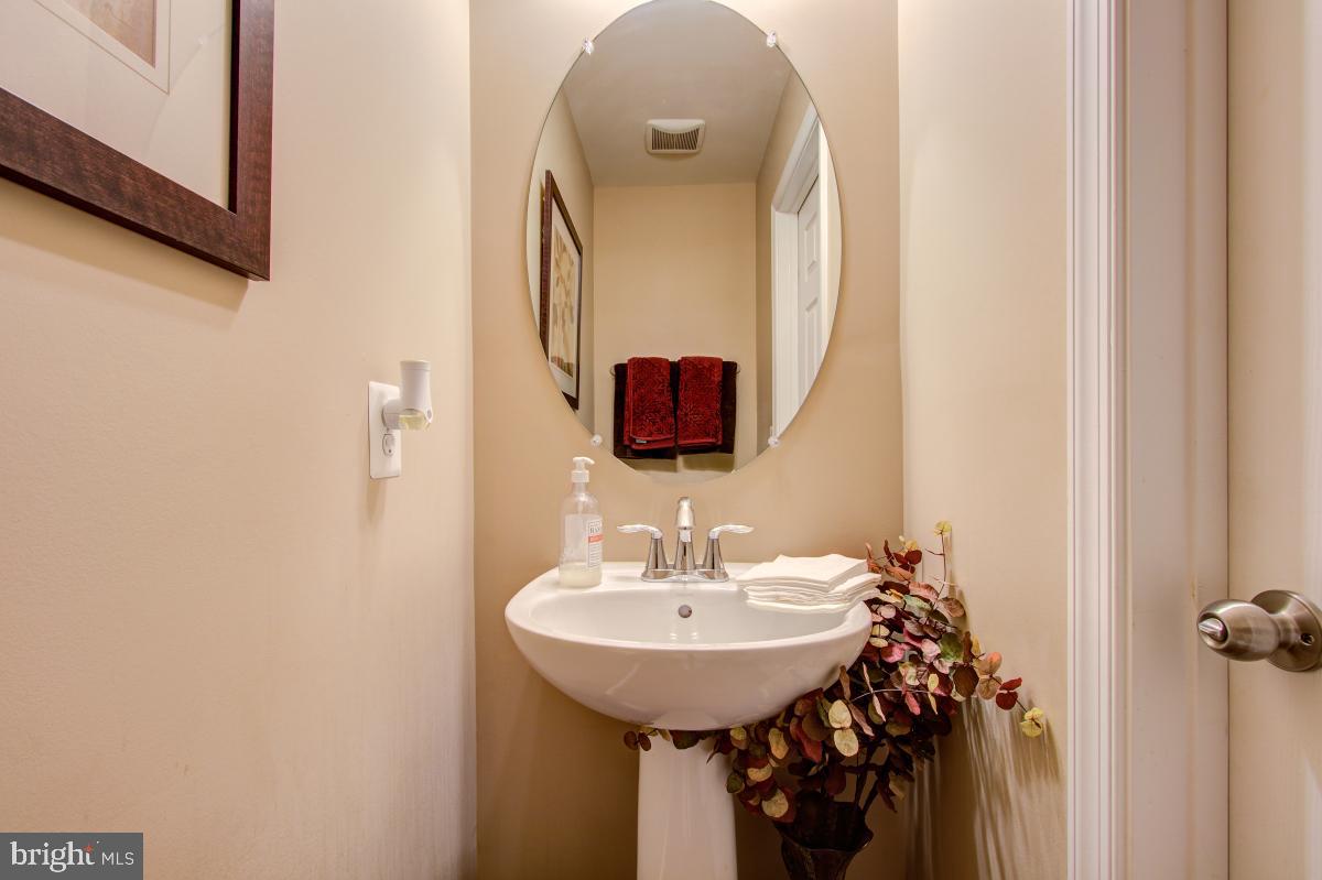 12601 Rustic Rock Lane Beltsville, MD 20705 - Photo 15 of 33 a bathroom with a sink and a mirror