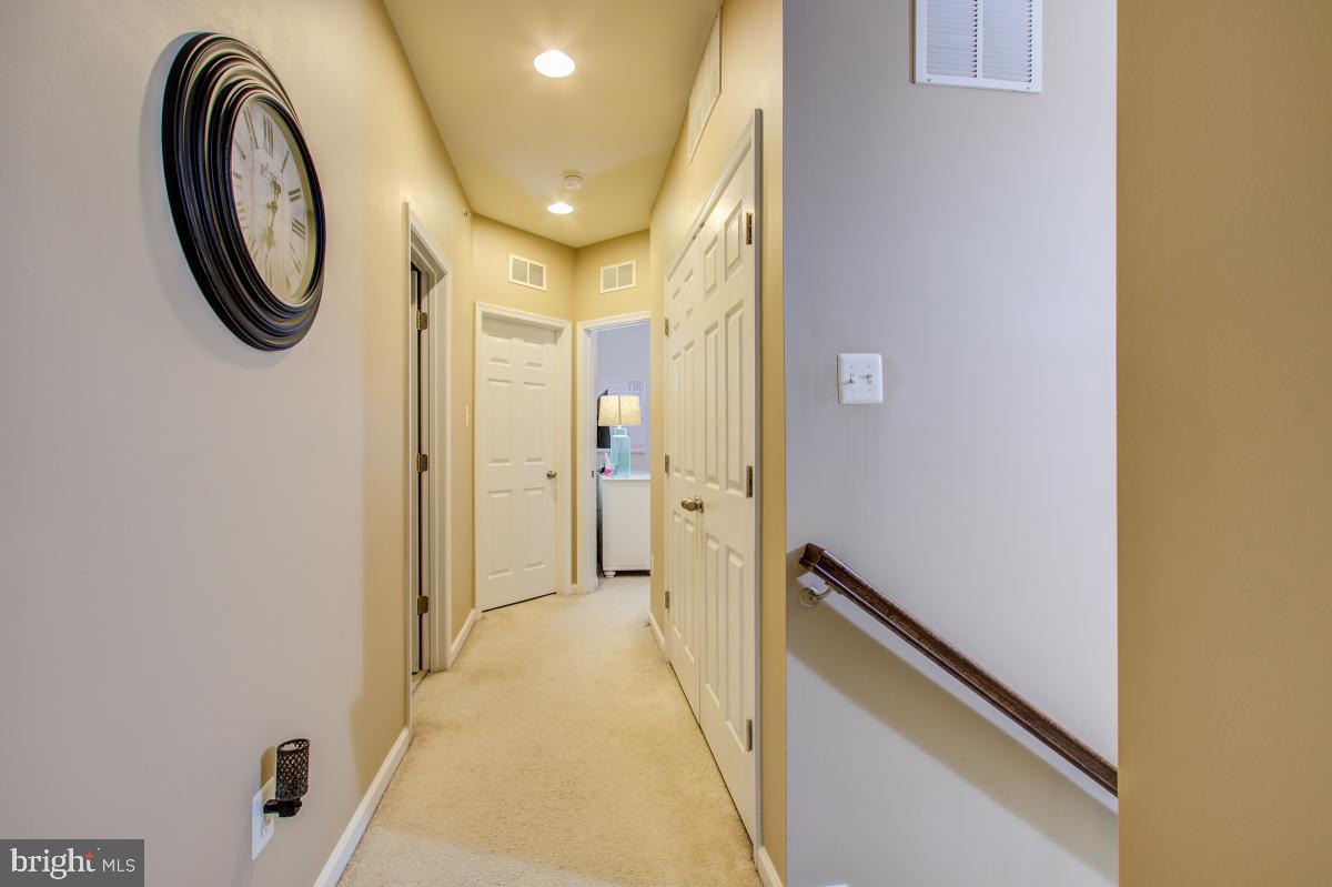 12601 Rustic Rock Lane Beltsville, MD 20705 - Photo 16 of 33 a view of a hallway with painted walls