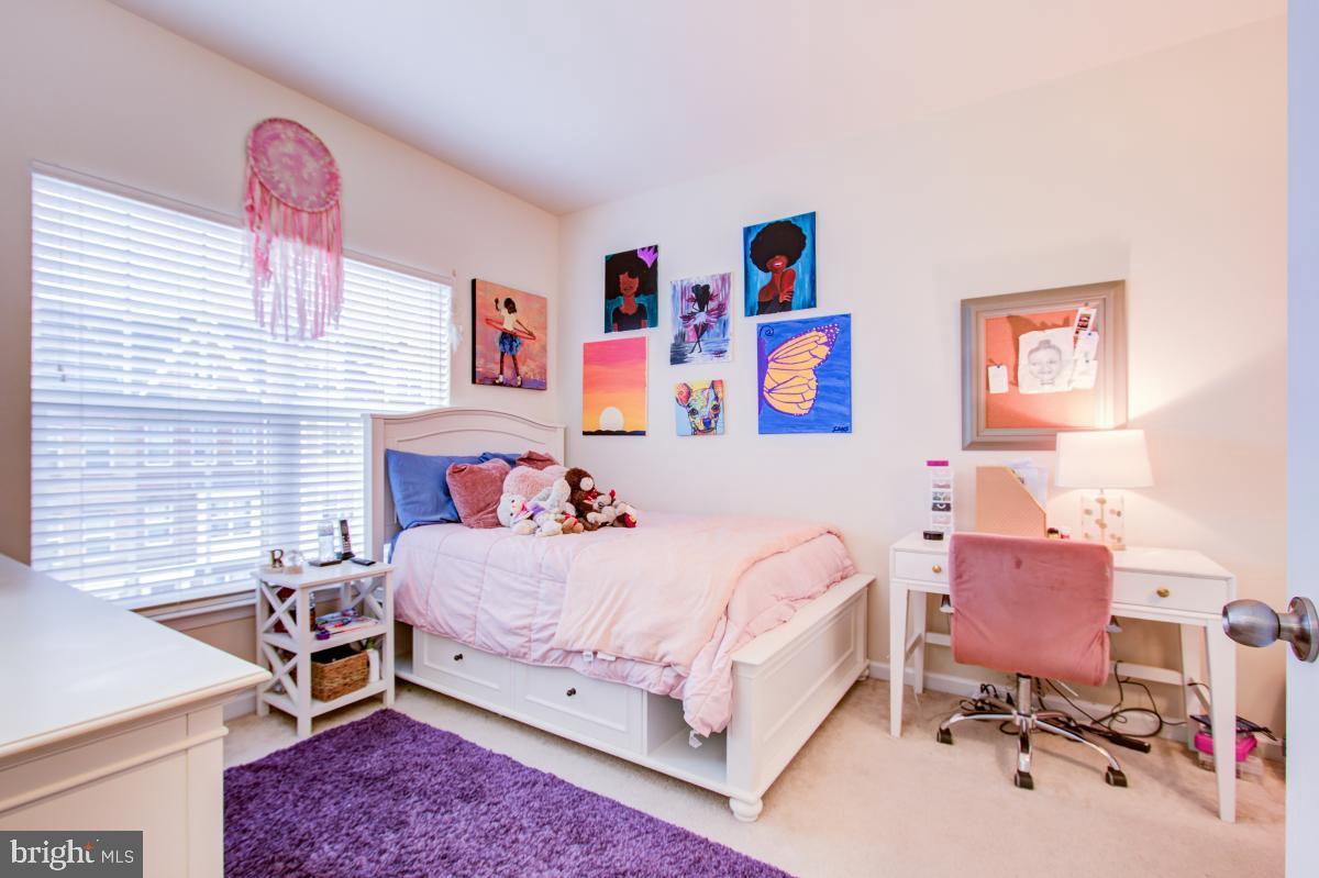 12601 Rustic Rock Lane Beltsville, MD 20705 - Photo 23 of 33 a bedroom with a bed and a workspace