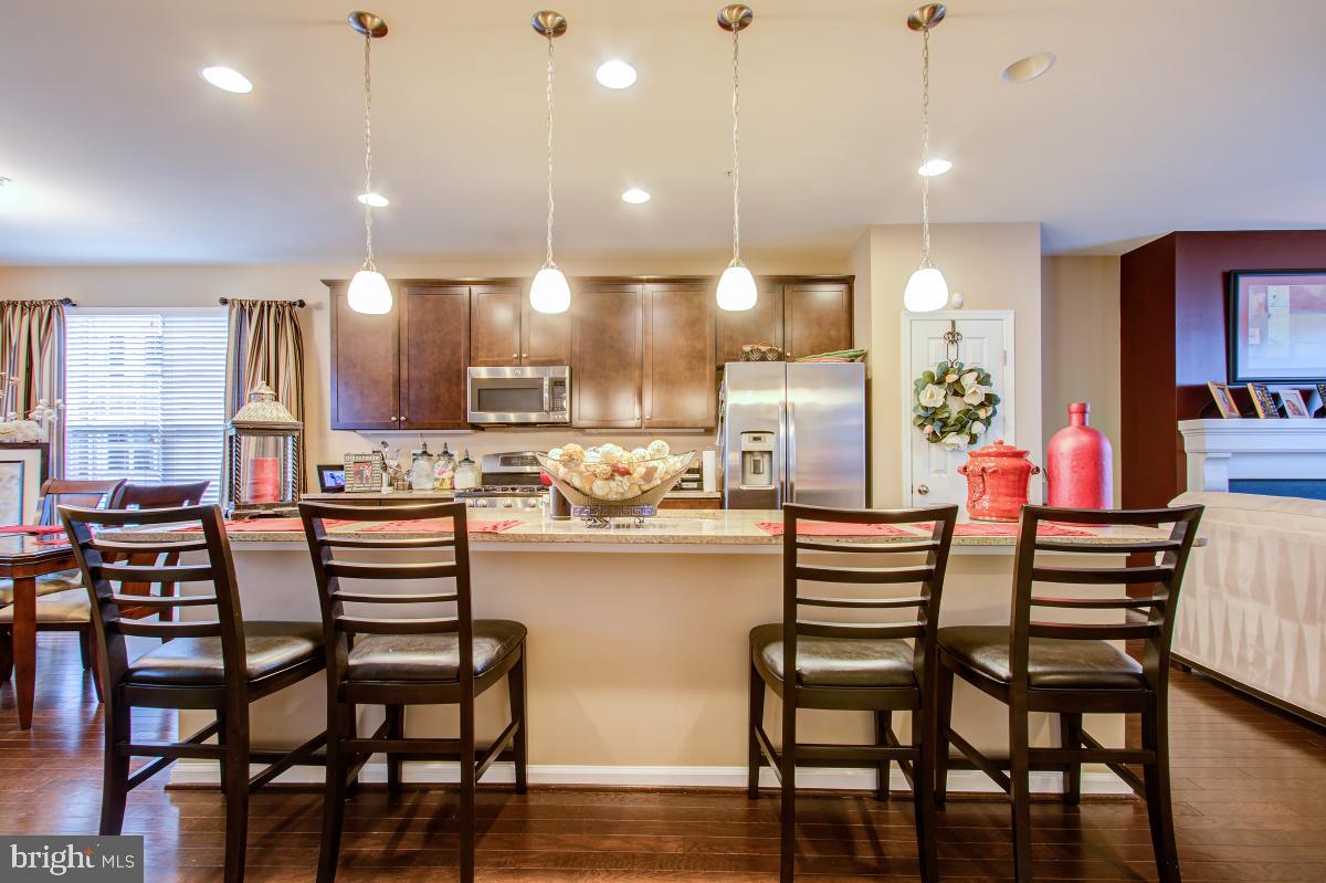 12601 Rustic Rock Lane Beltsville, MD 20705 - Photo 9 of 33 a large kitchen with a table and chairs