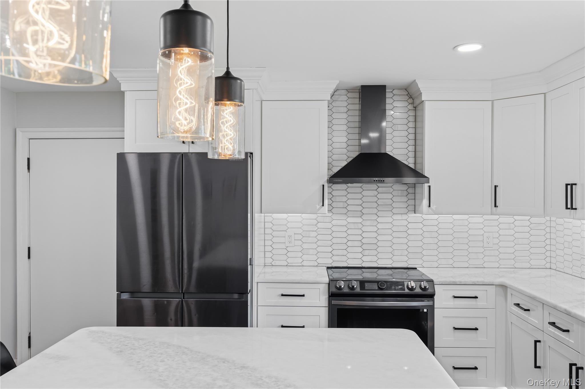 69 Silver Spring Road New Windsor, NY 12553 - Photo 6 of 20 a kitchen with a refrigerator and a stove