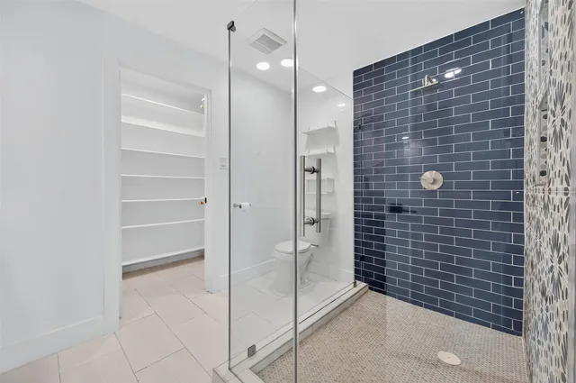 a bathroom with a granite countertop sink mirror and vanity