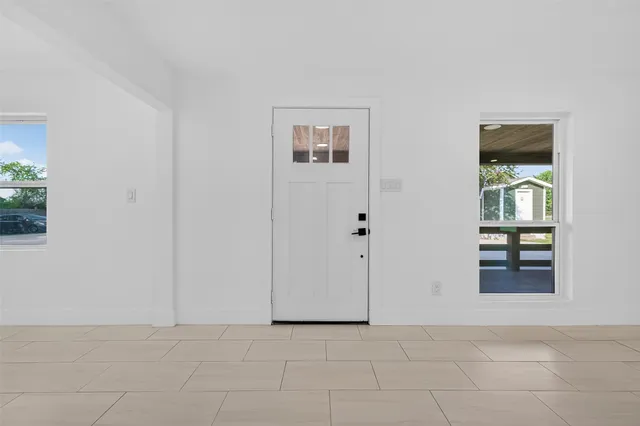 a view of an empty room and window