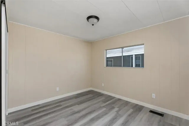 a bathroom with a shower sink vanity mirror and toilet