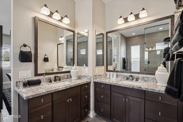 a bedroom with a bed and a flat tv screen on dresser