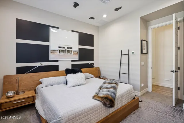 a view of a dining room with furniture a chandelier and wooden floor