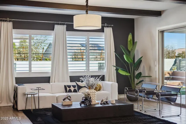 a bathroom with a table and a mirror