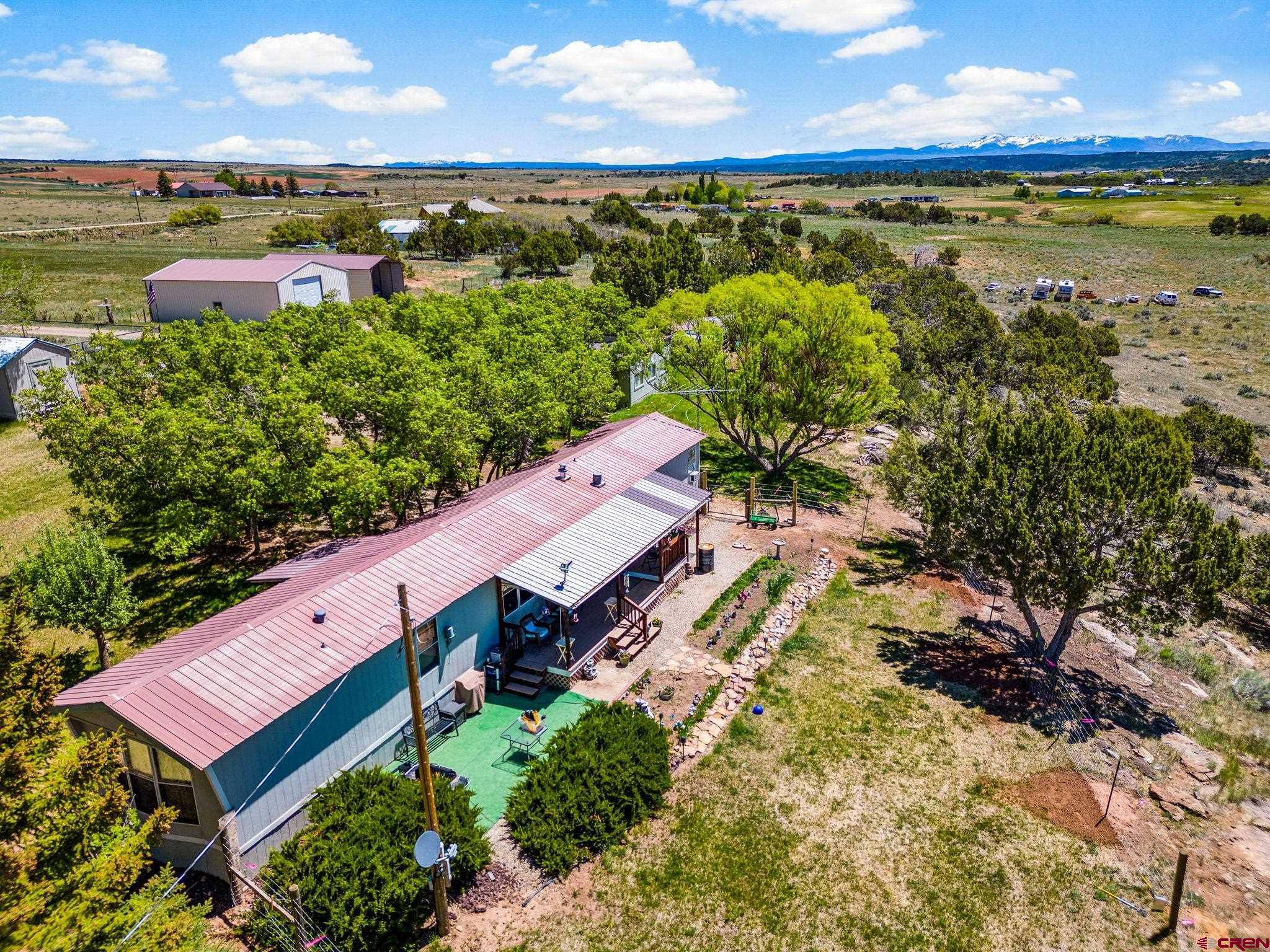 23300 Rd X Lewis, CO 81327 - Photo 1 of 44 a view of a city with an ocean view