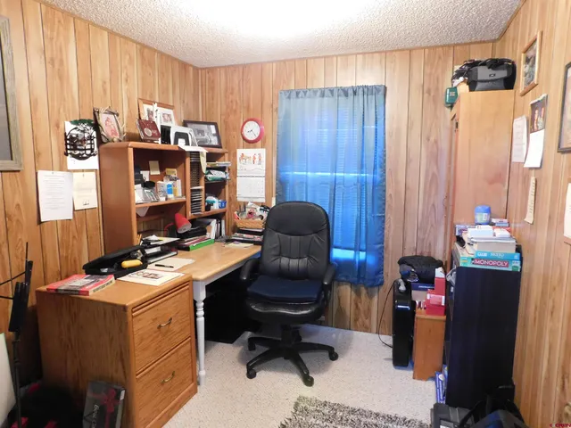 a work place with furniture and a window