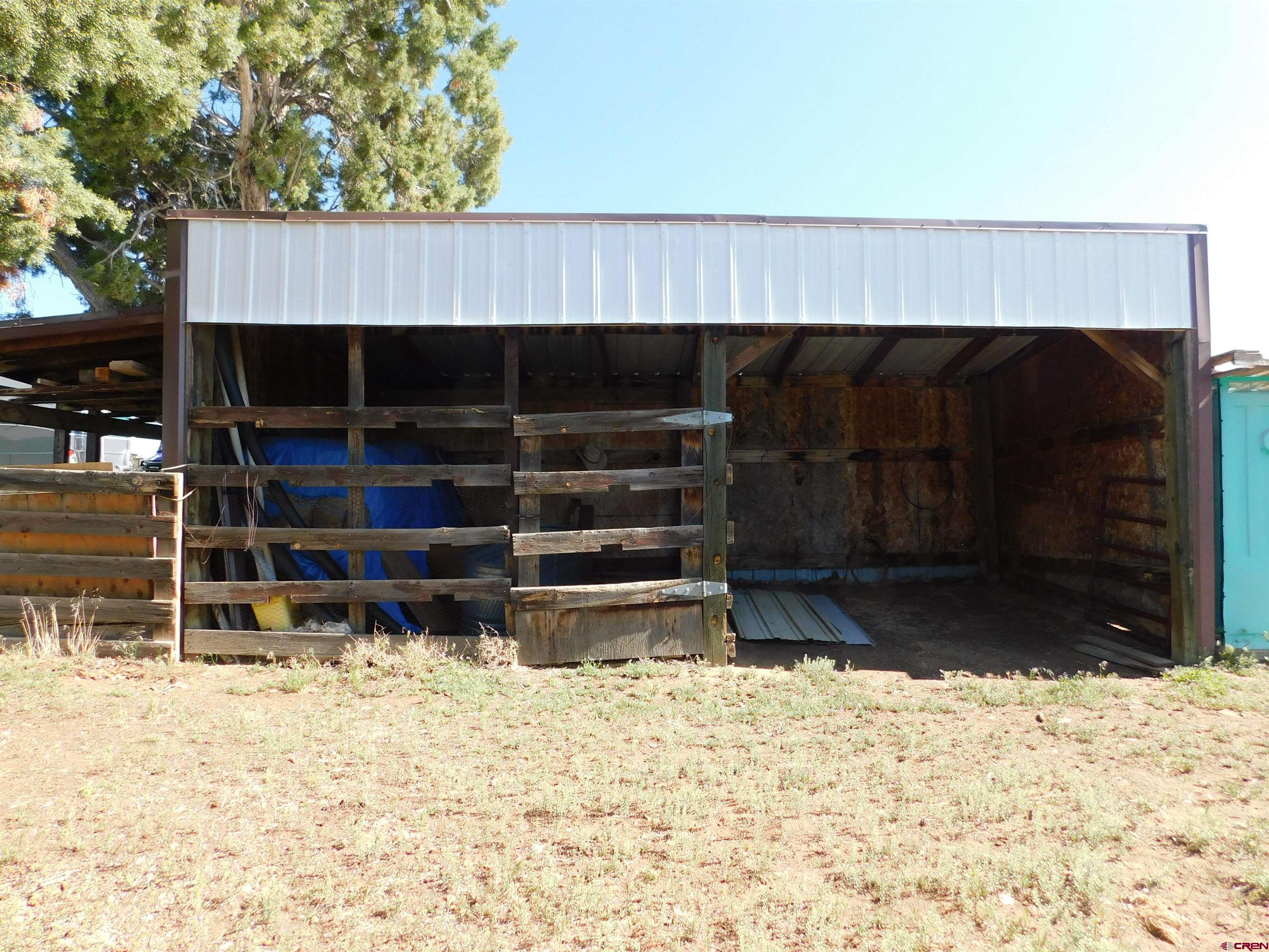 23300 Rd X Lewis, CO 81327 - Photo 26 of 44 a view of a backyard of the house