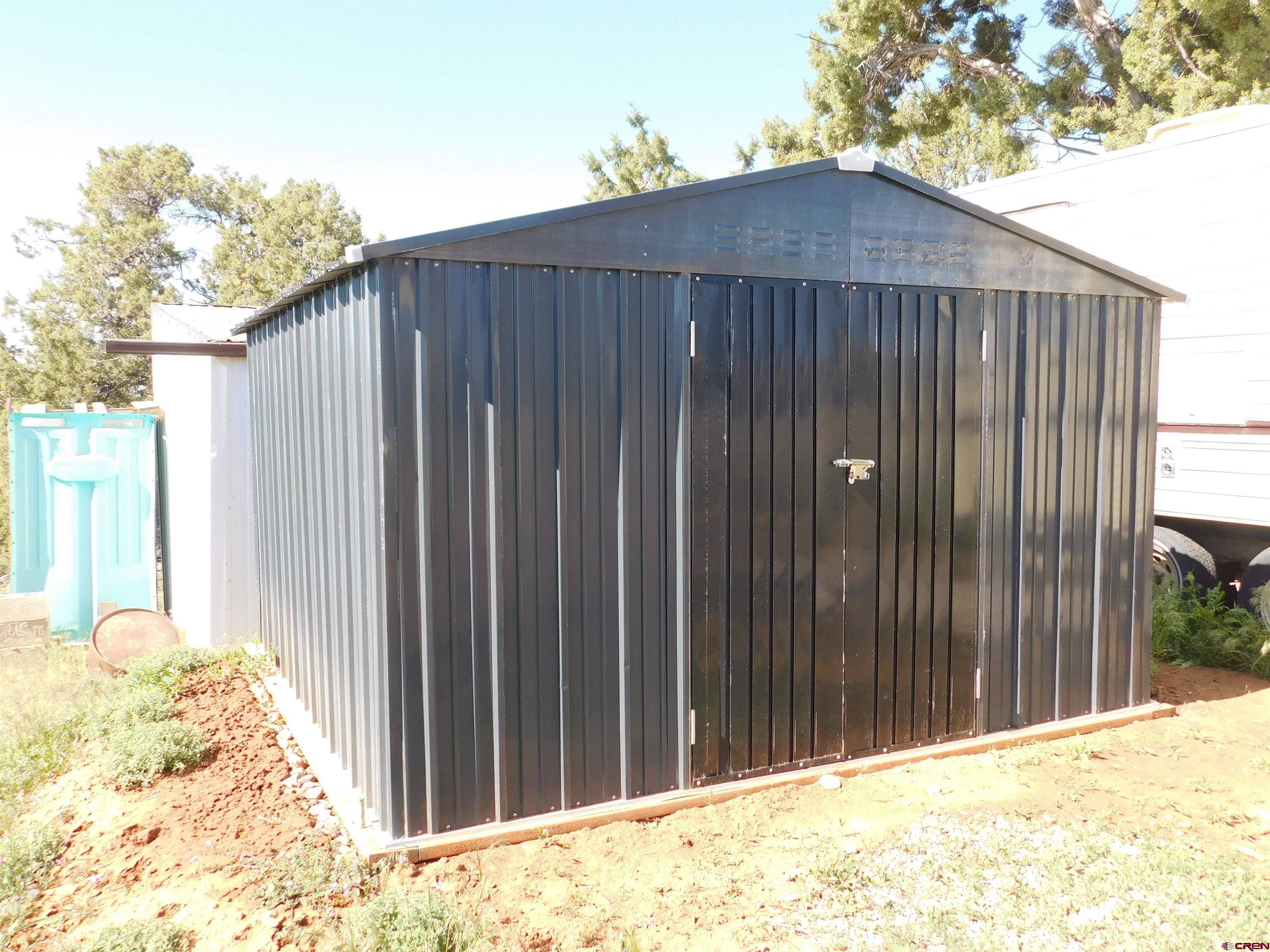 23300 Rd X Lewis, CO 81327 - Photo 27 of 44 a backyard of a house