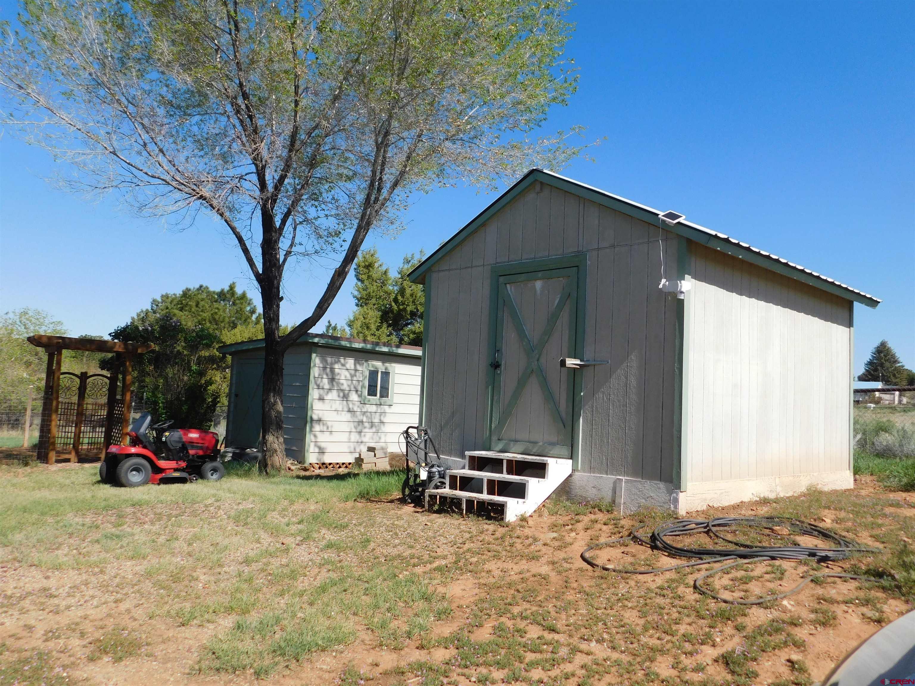 23300 Rd X Lewis, CO 81327 - Photo 31 of 44 a view of car parked in front of house