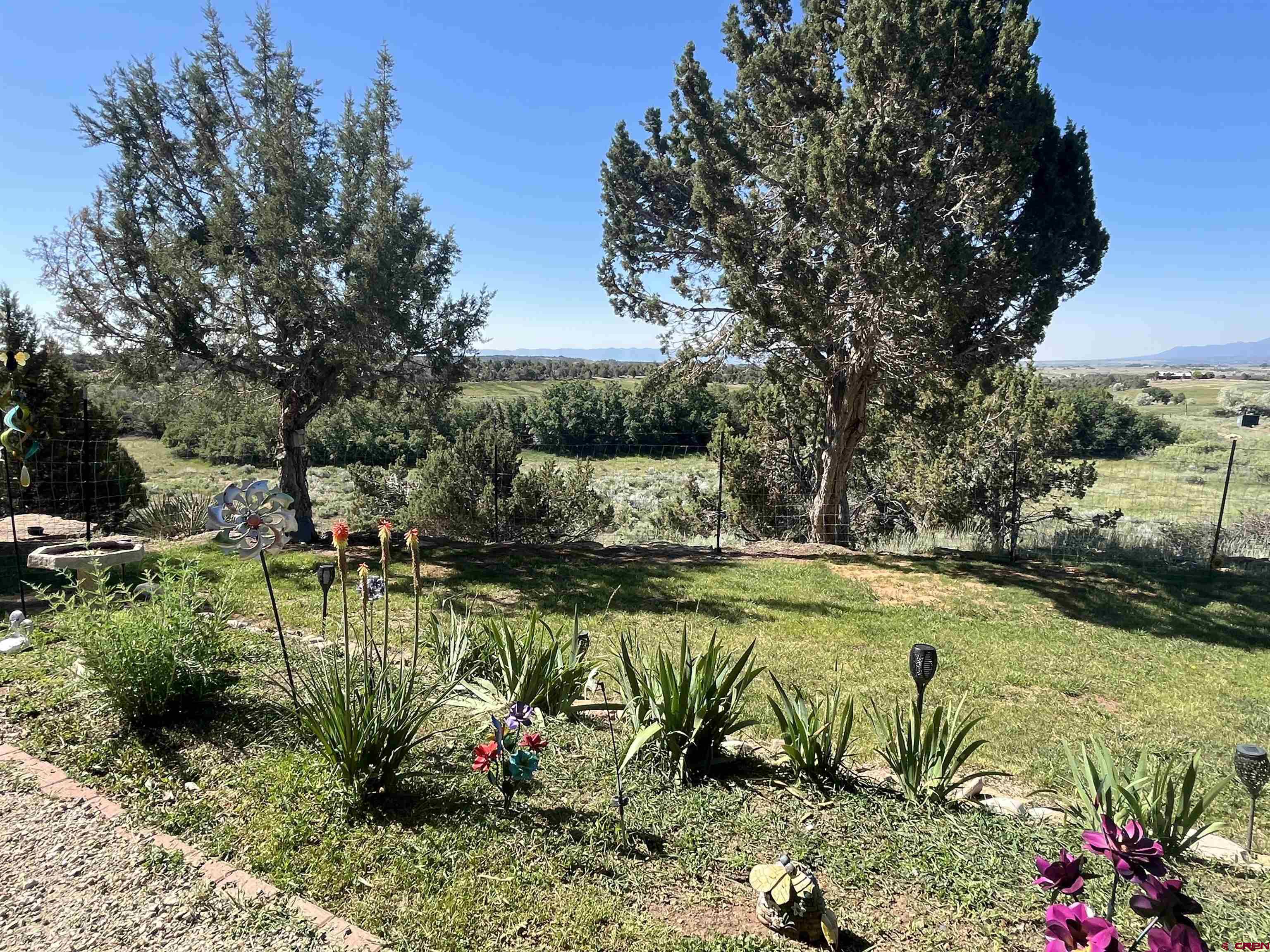 23300 Rd X Lewis, CO 81327 - Photo 36 of 44 a view of a swimming pool with a patio and garden