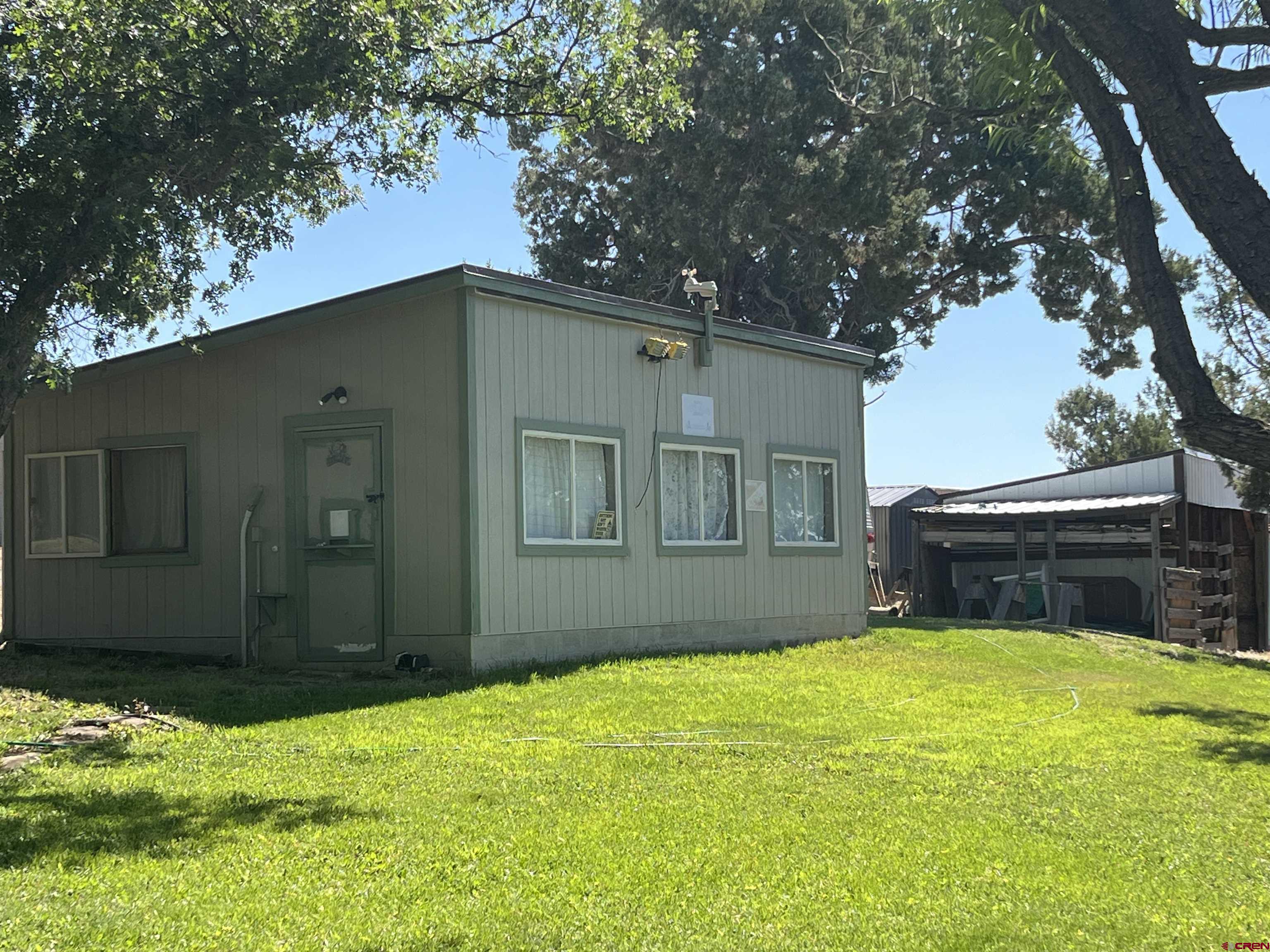 23300 Rd X Lewis, CO 81327 - Photo 39 of 44 a house view with swimming pool in front of it