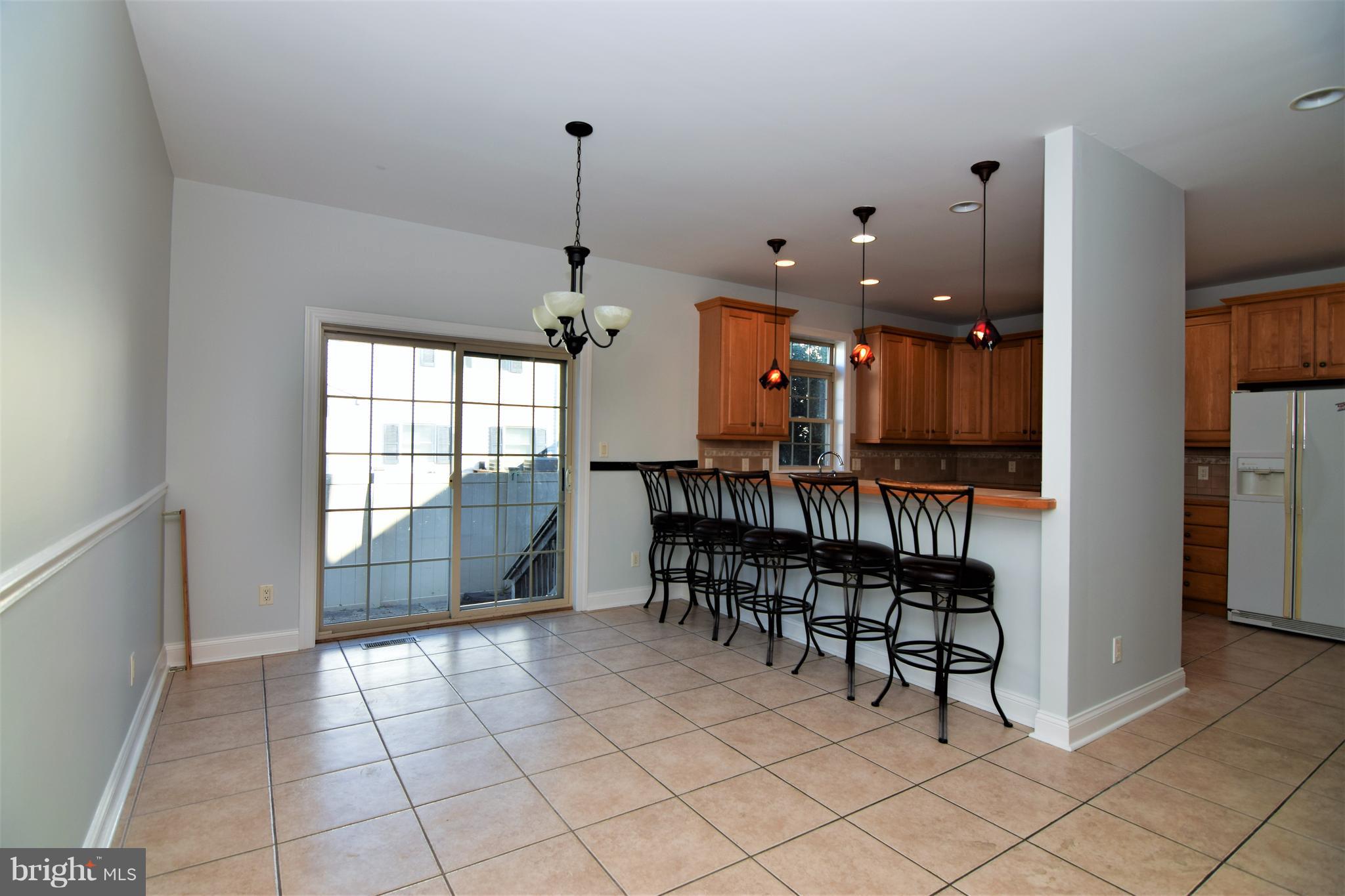 714 South Surf Road Ocean City, MD 21842 - Photo 11 of 38 Spacious dining area w breakfast bar!!